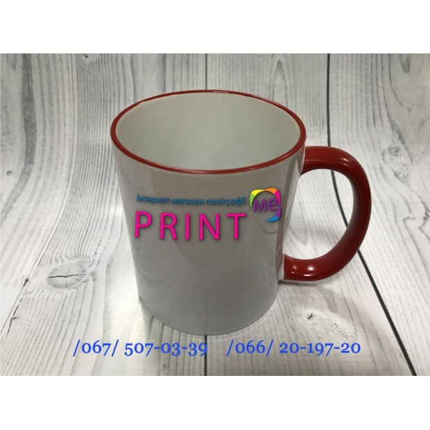 Cup with a red handle and a rim