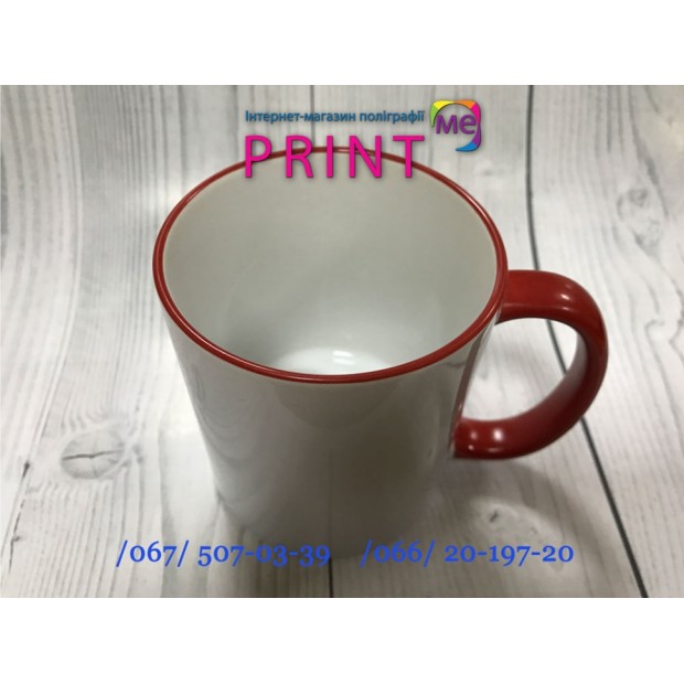 Cup with a red handle and a rim